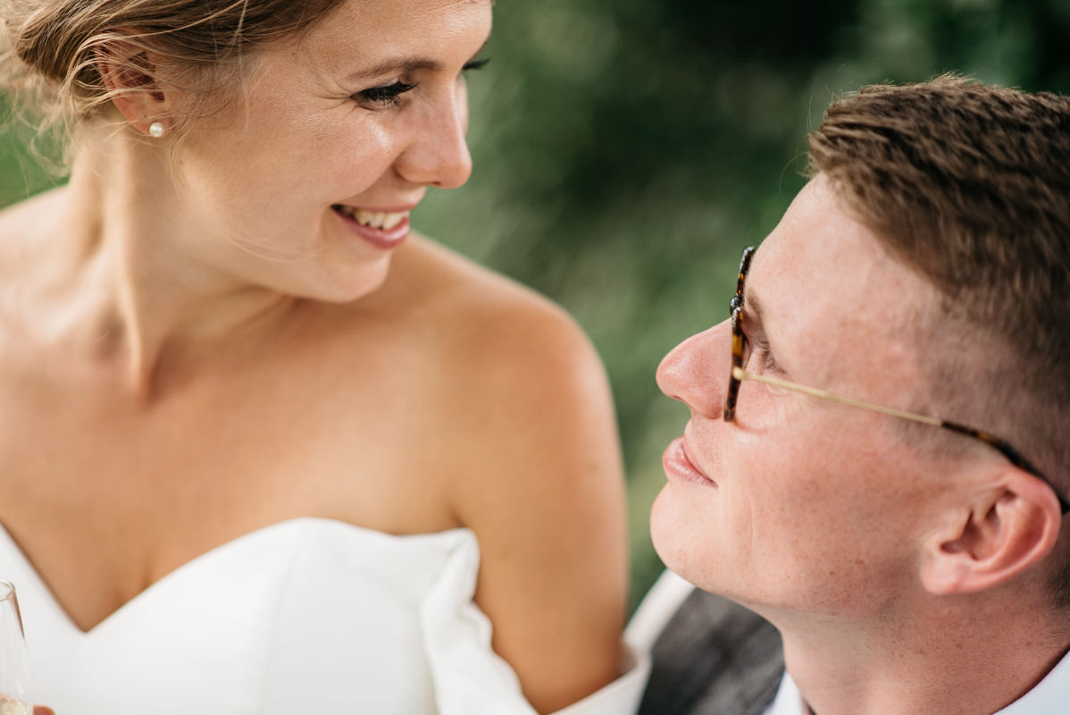 Couple gaze at each other during golden hour portraits